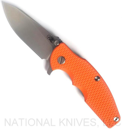 Rick Hinderer Knives Jurassic Slicer folding knife with thumb stud and flipper tab - shown open presentation side.  Stonewash MagnaCut stainless steel plain edge blade.  Orange G-10 handle scale with stonewash titanium lock side.  Model KJURSLMC.
