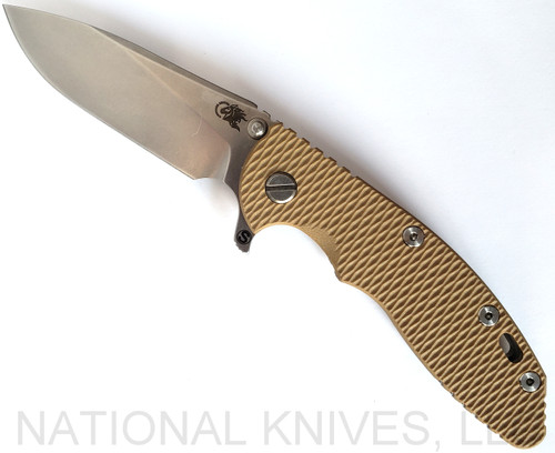Rick Hinderer Knives Skinny XM-18 3.5" Slicer folding knife with thumb stud and flipper tab - shown open presentation side.  Stonewash MagnaCut stainless steel plain edge blade.  Coyote G-10 handle with stonewash lock side.  Model KXM35SKSL.