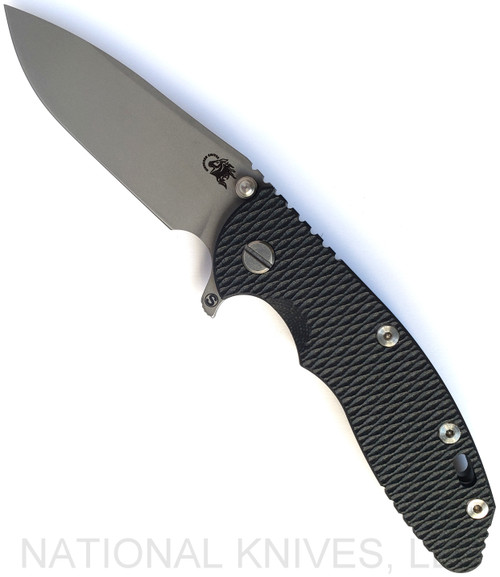 Rick Hinderer Knives Skinny XM-18 3.5" Slicer folding knife with thumb stud and flipper tab - shown open presentation side.  Working Finish MagnaCut stainless steel plain edge blade.  Black G-10 handle with Working Finish lock side.  Model KXM35SKSL.