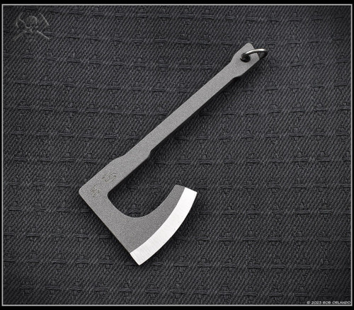 RMJ Tactical Mortifer Mini Tomahawk pendant - shown out of sheath reverse.  Dark Antracite Cerakote Nitro-V stainless steel construction.  