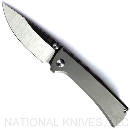 Chaves Knives RCK9 Drop Point folding knife with nail nick - shown open presentation side.  Satin M390 stainless steel plain edge blade.  Stonewash titanium handle.  Model RCK9/DP/SWTI/BF.