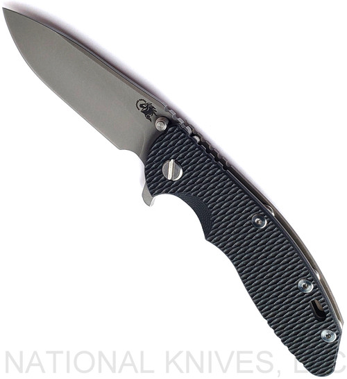 Rick Hinderer Knives XM-18 3.5" Slicer folding knife with thumb stud and flipper tab - shown open presentation side.  Working Finish S45VN stainless steel plain edge blade.  Black G-10 handle with Battle Bronze lock side.  Model KXM35SL.
