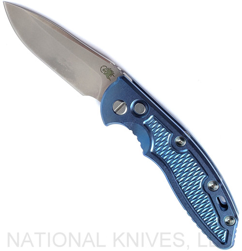 Rick Hinderer Knives Automatic XM-18 Spear Point folding knife with push button - shown open presentation side.  Stonewash 20CV stainless steel plain edge blade.  Stonewash blue titanium handle.  Model KAXM35SPE.