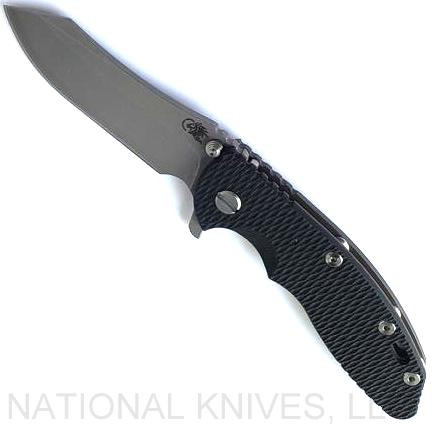 Rick Hinderer Knives XM-18 3.5" Skinner folding knife with thumb stud and flipper tab - shown open presentation side.  Working Finish S45VN stainless steel plain edge blade.  Black G-10 handle with Battle Bronze lock side.  Model KXM35SKINNER.
