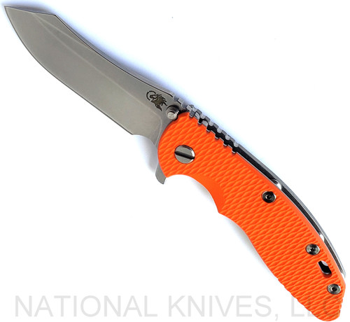 Rick Hinderer Knives XM-18 3.5" Skinner folding knife with thumb stud and flipper tab - shown open presentation side.  Stonewash S45VN stainless steel plain edge blade.  Orange G-10 handle with stonewash lock side.  Model KXM35SKINNER.