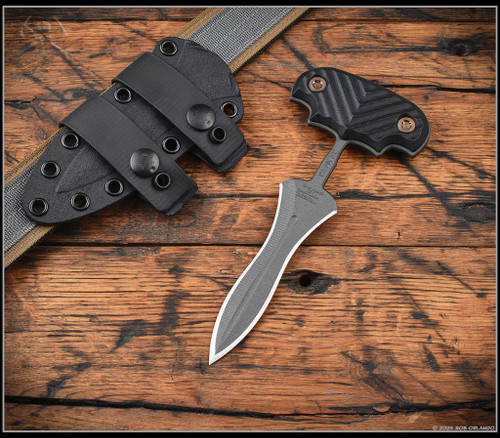 RMJ Tactical Reaver fixed blade knife - shown out of sheath obverse with sheath aside it.  Tungsten Cerakote Nitro-V stainless steel plain double edge blade.  Black G-10 handle.  Model JCD-RV-TU-BK.