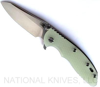 Rick Hinderer Knives XM-18 3.5" Sheepsfoot folding knife with thumb stud and flipper tab - shown open presentation side.  Stonewash S45VN stainless steel plain edge blade.  Translucent Green G-10 handle with stonewash bronze lock side.  Model KXM35SHF.
