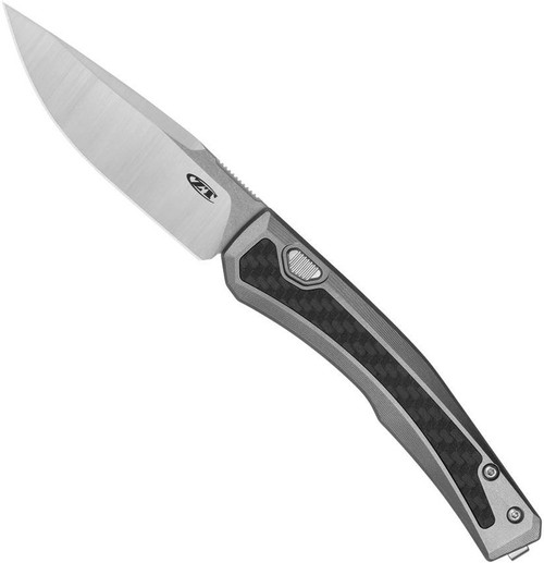 Zero Tolerance 0556 push button automatic knife - open - button side.  Satin 3.35" MagnaCut stainless steel plain edge blade.  Titanium handle with black carbon fiber inlay.  Model 0556.