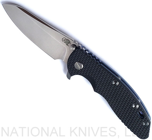 Rick Hinderer Knives XM-18 3.5" Sheepsfoot folding knife with thumb stud and flipper tab - shown open presentation side.  Stonewash S45VN stainless steel plain edge blade.  Black G-10 handle with stonewash blue lock side.  Model KXM35SHF.
