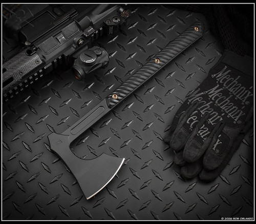 RMJ Tactical Raven axe - shown out of sheath obverse.  Graphite Black 80CRV2 steel plain edge head.  Black G-10 handle.  Model T-RA-GB-BK.