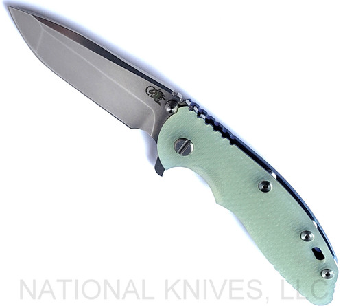 Rick Hinderer Knives XM-18 3.5" Spanto folding knife with thumb stud and flipper tab - shown open presentation side.  Stonewash S45VN stainless steel plain edge blade.  Translucent Green G-10 handle with stonewash blue lock side.  Model KXM35SPA.