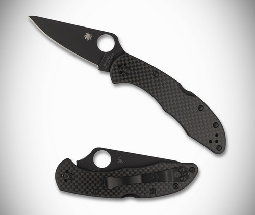 Spyderco Delica 4 TKD Exclusive folding knife with thumb hole - shown open presentation side and closed pocket clip side.  Black Cru-Wear steel plain edge blade.  Black carbon fiber handle.  Model C11CFPBK.