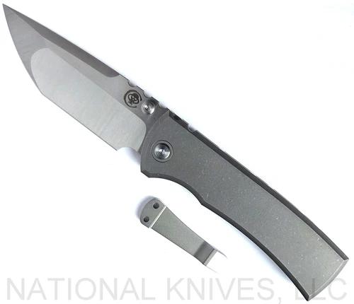 Chaves Knives Integral Redencion 229 folding knife featuring a thumb stud - shown open presentation side.  Belt satin M390 stainless steel tanto style plain edge blade.  Stonewash titanium handle.  Model CK-1C1-2A1A-1A0!