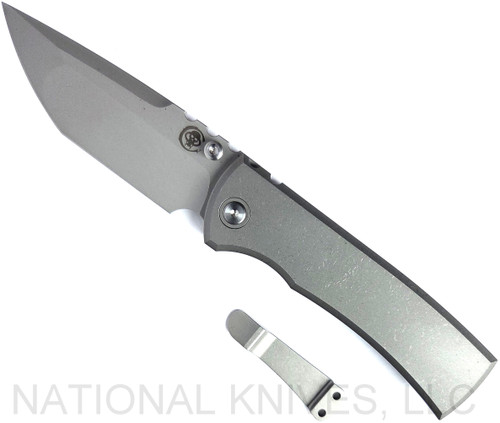 Chaves Knives Integral Redencion 229 folding knife featuring a thumb stud - shown open presentation side.  Stonewash M390 stainless steel tanto style plain edge blade.  Stonewash titanium handle.  Model CK-1C1-2B1A-1A0!