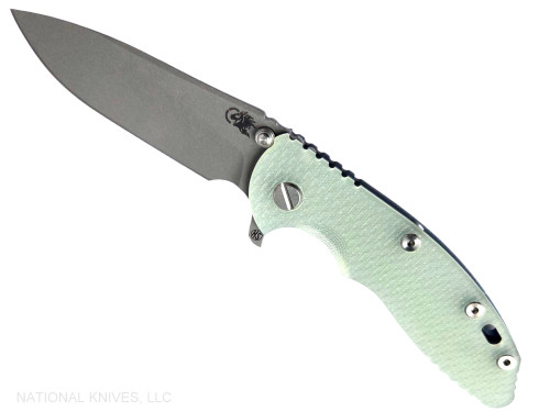 Rick Hinderer Knives XM-18 Skinny Slicer with thumb stud and flipper tab - shown open presentation side.  Working Finish Magnacut stainless steel, hollow ground, plain edge blade.  Translucent Green G-10 handle with Battle Blue lock side. 