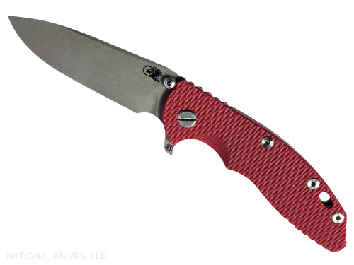 Rick Hinderer Knives XM-18 Skinny Slicer with thumb stud and flipper tab - shown open presentation side.  Working Finish Magnacut stainless steel, hollow ground, plain edge blade.  Red G-10 handle with Working Finish lock side. 