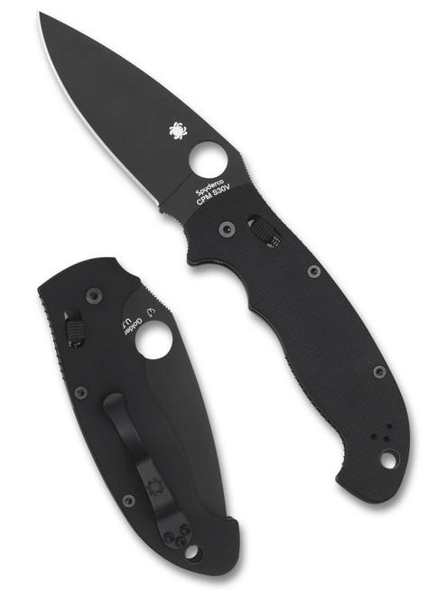 Spyderco Manix 2 XL folding knife with thumb hole - shown open presentation side and closed pocket clip side.  Black S30V stainless steel plain edge blade. Black G-10 handle.  Model C95GPBBK2.