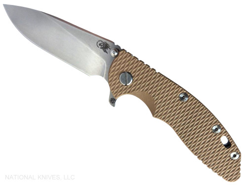 Rick Hinderer Knives XM-18 Skinny Slicer with thumb stud and flipper tab - shown open presentation side.  Stonewash Magnacut stainless steel, hollow ground, plain edge blade.  Coyote Brown G-10 handle with stonewash lock side. 