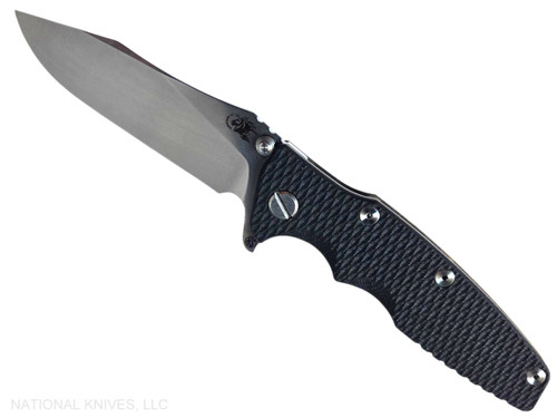 Rick Hinderer Knives Skinny Eklipse Slicer folding knife with flipper tab - shown open - presentation side.  Stonewash 3.5" hollow grind MagnaCut stainless steel plain edge blade.  Black G-10 handle scale with stonewashed bronze lock side.  Model KEK35SKSLHO