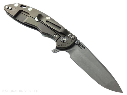 Rick Hinderer Knives XM-18 3.5" Spanto folding knife with thumb stud and flipper tab - shown open lock side.  Working Finish 20CV stainless steel plain edge blade.  Translucent Green G-10 handle with Battle Bronze lock side.  Model KXM35SPA.