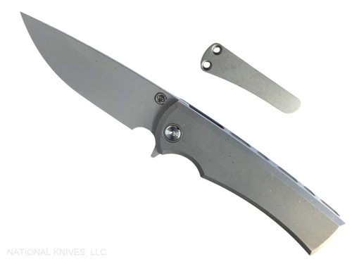 Chaves Knives Liberation Street Integral folding knife featuring a flipper tab - shown open presentation side.  Stonewash M390 stainless steel drop point style plain edge blade.  Stonewash titanium handle.  Model CK-2B1-1B1A-1A0!