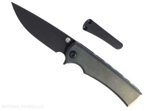 Chaves Knives Liberation Street Integral folding knife featuring a flipper tab - shown open presentation side.  Gray PVD M390 stainless steel drop point style plain edge blade.  Gray PVD titanium handle.  Model CK-2B1-1C1A-4A15!