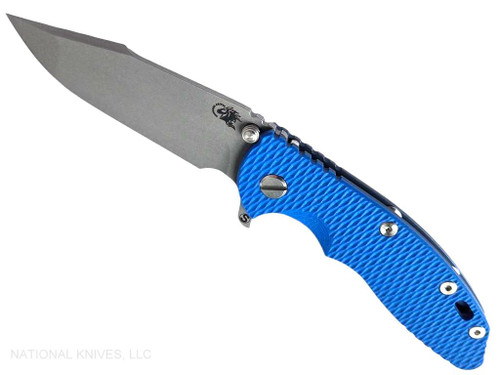 Rick Hinderer Knives XM-18 Skinny Harpoon Spanto with thumb stud and flipper tab - shown open presentation side.  Working Finish MagnaCut stainless steel plain edge blade.  Blue G-10 handle with Battle Blue lock side.  Model KXM35SKHS.