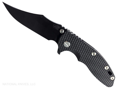 Rick Hinderer Knives XM-18 3.5" Bowie folding knife with thumb stud and flipper tab - shown open presentation side.  Battle Black MagnaCut stainless steel plain edge blade.  Black G-10 handle with Battle Black lock side.  Model KXM35BOWMC.