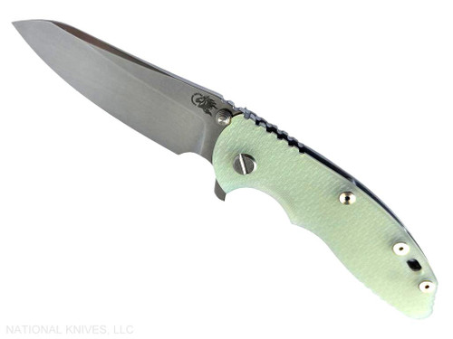 Rick Hinderer Knives XM-18 3.5" Sheepsfoot folding knife with thumb stud and flipper tab - shown open presentation side.  Stonewash S45VN stainless steel plain edge blade.  Translucent Green G-10 handle with stonewash lock side.  Model KXM35SHF.