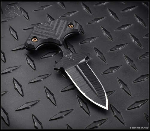 RMJ Tactical BUB Back Up Blade fixed blade knife - shown out of sheath reverse.  Textured Graphite Black Cerakote MagnaCut stainless steel plain double edge blade.  Black G-10 handle.  Model K-BUB-MC-BT-BK.