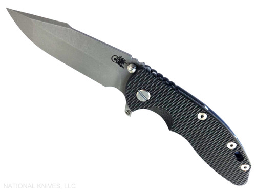 Rick Hinderer Knives XM-18 Skinny Harpoon Spanto with thumb stud and flipper tab - shown open presentation side.  Working Finish MagnaCut stainless steel plain edge blade.  Black G-10 handle with Battle Blue lock side.  Model KXM35SKHS.