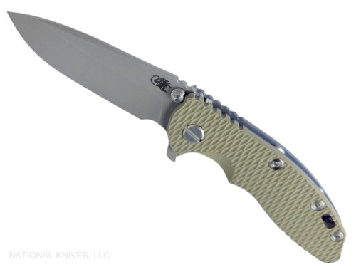 Rick Hinderer Knives XM-18 3.25" Spear Point folding knife with thumb stud and flipper tab - shown open presentation side.  Working Finish S45VN stainless steel plain edge blade.  OD green G-10 handle with Battle Blue lock side.  Model KXM325SPE.