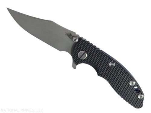 Rick Hinderer Knives XM-18 3.0" Bowie folding knife with thumb stud and flipper tab - shown open presentation side.  Working Finish 20CV stainless steel plain edge blade.  Black G-10 handle with Battle Blue lock side.  Model KXM30BOW.