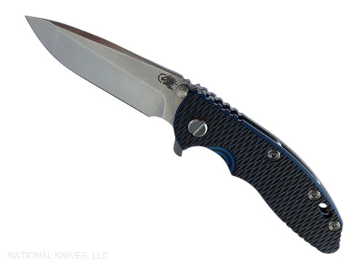 Rick Hinderer Knives XM-18 3.25" Spanto folding knife with thumb stud and flipper tab - shown open presentation side.  Stonewash MagnaCut stainless steel plain edge blade.  Blue - black G-10 handle with stonewash lock side.  Model KXM325SPA.