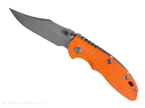 Rick Hinderer Knives Non Flipper XM-18 3.5" Bowie folding knife with thumb stud - shown open presentation side.  Stonewashed MagnaCut stainless steel plain edge blade.  Orange G-10 handle with Bead Blast Bronze lock side.  Model KXM35NFBO.