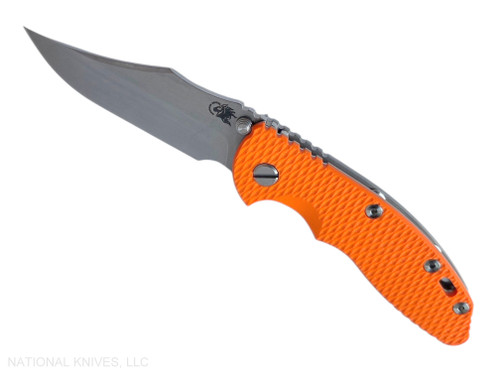 Rick Hinderer Knives Non Flipper XM-18 3.5" Bowie folding knife with thumb stud - shown open presentation side.  Stonewashed MagnaCut stainless steel plain edge blade.  Orange G-10 handle with Bead Blast lock side.  Model KXM35NFBO.