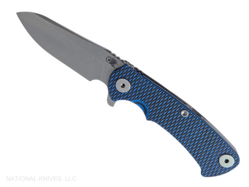 Rick Hinderer Knives Project X Sheepsfoot folding knife with flipper tab - shown open presentation side.  Stonewash MagnaCut stainless steel plain edge blade.  Blue - black G-10 handle with Working Finish lock side.  Model KPXSHF.
