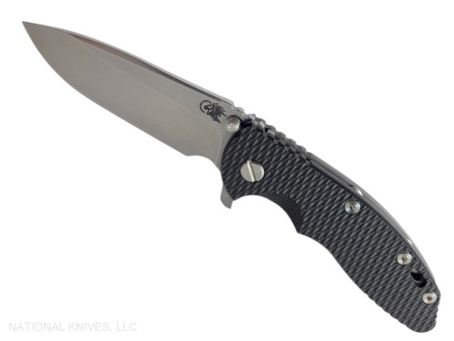 Rick Hinderer Knives XM-18 3.5" Spear Point folding knife with thumb stud and flipper tab - shown open presentation side.  Stonewash MagnaCut stainless steel plain edge blade.  Black G-10 handle with Working Finish lock side.  Model KXM35SPE.