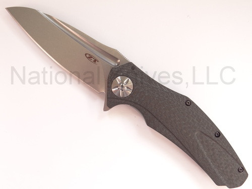 Zero Tolerance 0777-M390 folding knife with flipper tab - open - logo side.  Satin M390 stainless steel plain edge blade.  Black carbon fiber handle.  Model 0777-M390.
For reference only.