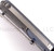 Todd Begg Knives Bodega 2.0 folding knife with flipper tab - shown close up of back spacer.  2-tone N690 stainless steel plain edge blade.  Blue titanium handle.
For reference only.