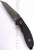 Rick Hinderer Knives FXM Spanto fixed blade knife - shown out of sheath reverse.  Stonewash S35VN stainless steel plain edge blade.  Black G-10 handle.  Model K6012000SP.