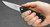 Kershaw Entropy assisted opening folding knife with flipper tab - shown open in hand.  8Cr13MoV stainless steel plain edge blade.  Black GFN handle.  Model 1885.
For reference only.