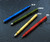 Rick Hinderer Knives Investigator ink pen - shown with cap on - along with three other colors.  Matte blue aluminum construction.  Model P58010A4BLA