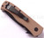 Emerson Knives CQC-7V BTS folding knife with thumb disk and Emerson Wave opener - shown closed pocket clip side.  Black 154CM stainless steel, "V" ground, combo edge blade.  Tan G-10 handle.  Model CQC-7V-BTS.
