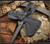 RMJ Tactical Eagle Talon tomahawk - shown close up of head in sheath obverse.  Tungsten Cerakote 80CRV2 steel plain edge head.  Black G-10 handle.  Model T-ET-TU-BK.