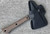 RMJ Tactical Mini Jenny tomahawk - shown in sheath obverse.  Tungsten Cerakote 80CRV2 steel plain edge head.  Hyena Brown G-10 handle.  
For reference only.
