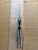 USED Rick Hinderer Knives XM-18 Automatic Spearpoint knife with push button - close up of bottom view of handle.  Stonewash 20CV stainless steel plain edge blade.  Anodized bronze titanium handle. 