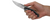 Zero Tolerance 0470 folding knife with a flipper tab - shown open in hand.  20CV stainless steel plain edge blade.  Titanium handle with black marble carbon fiber inlay.  Model 0470.