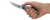 Zero Tolerance 0460TI folding knife with flipper tab - open - shown in hand.  Satin 3.25" 20CV stainless steel plain edge blade.  Titanium handle.  Model 0460TI.
For reference only.