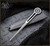 RMJ Tactical Quill pocket awl multitool - shown out of sheath obverse with sheath in background.  Titanium Cerakote CPM-3V steel construction.